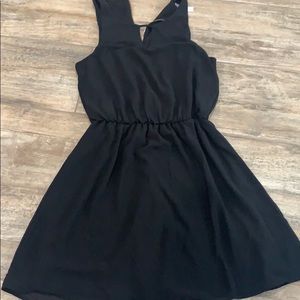 Black dress with gold zipper in back